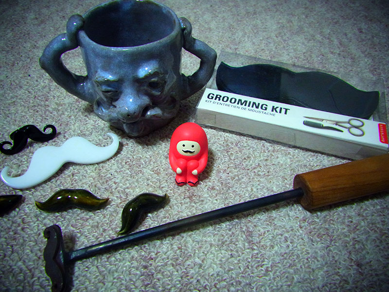 assortment of mustache goods and props