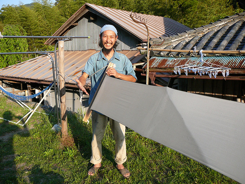 japanese man with a stretched cloth