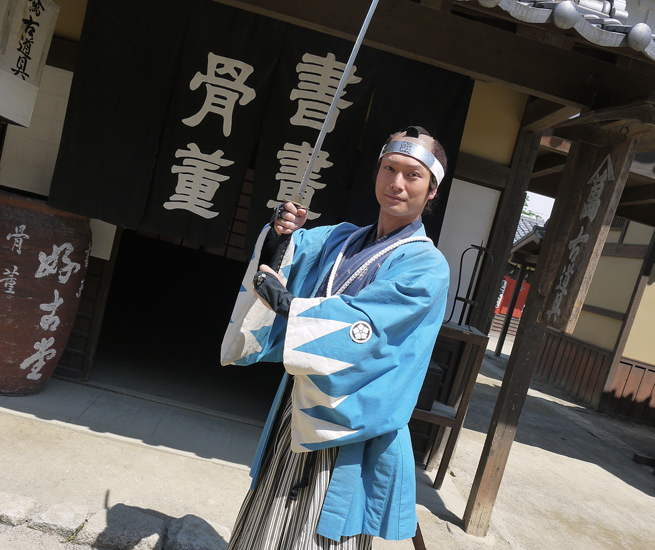 Takahiro Hotta posing with katana on set