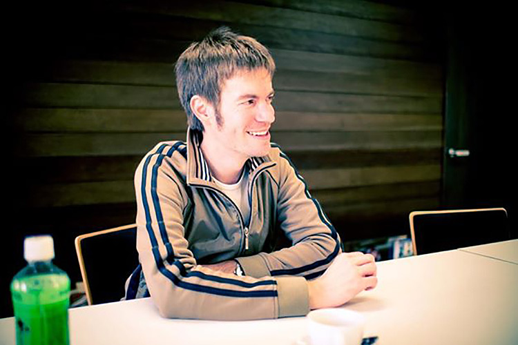 author brian ashcraft sitting at table with head turned