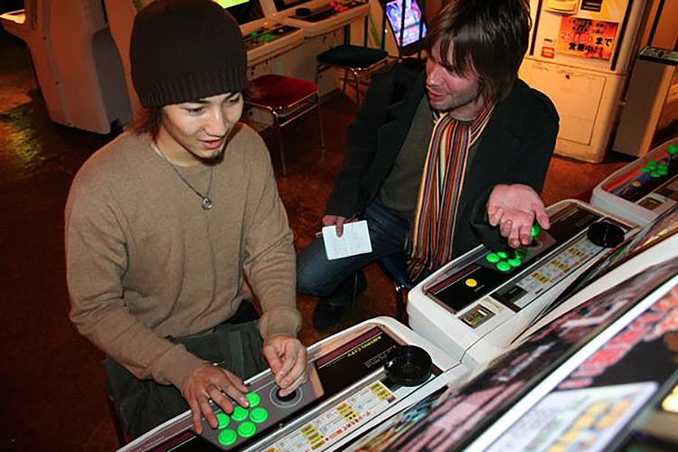 japanese teenage boy at arcade being interviewed by brian ashcraft