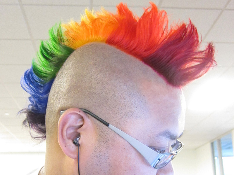 enfu with glasses with a rainbow mohawk