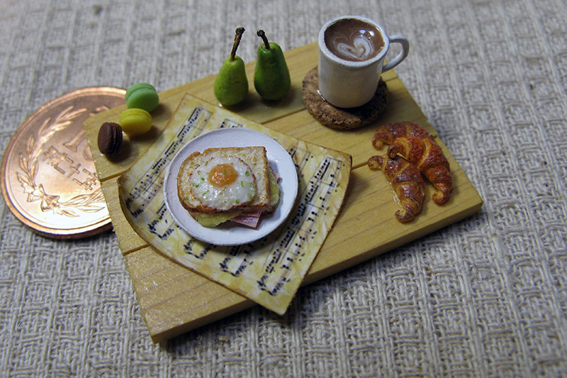 A miniature croque madame with coffee