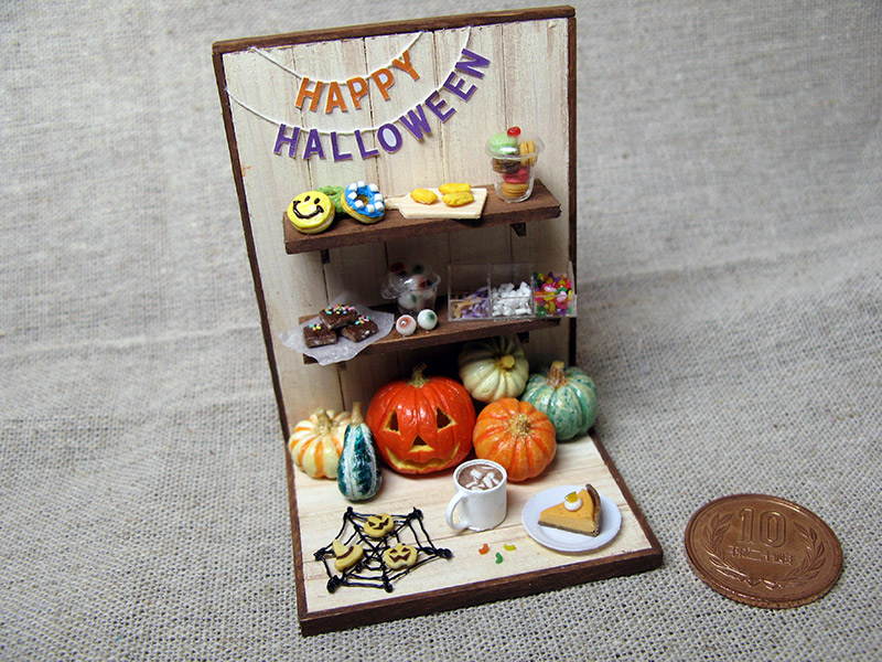 A miniature Halloween scene with spooky-themed food