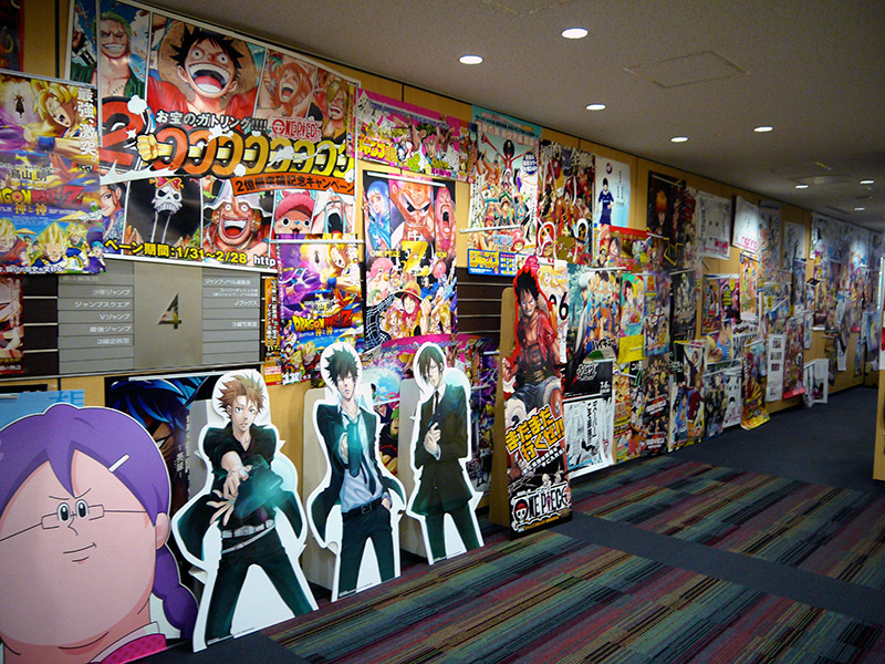 the hallway inside shueisha filled with manga art