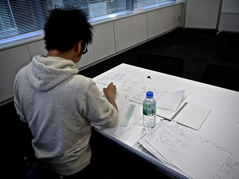 an artist working on manga at shueisha