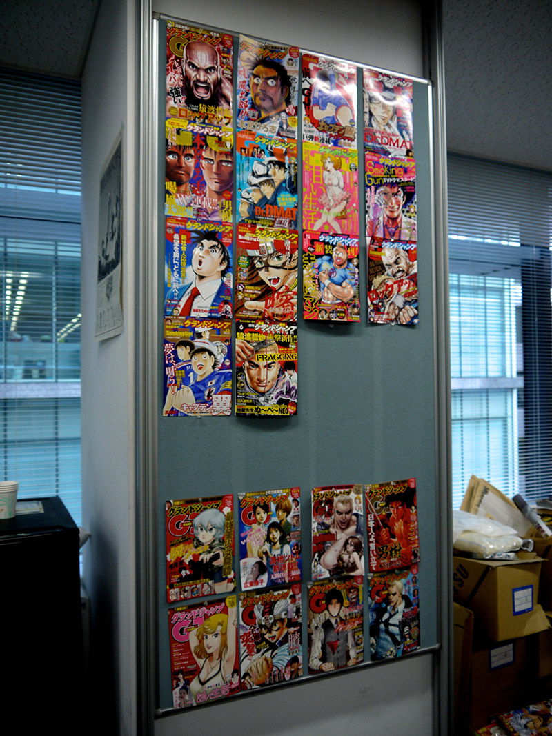 manga covers on the wall of the shueisha office