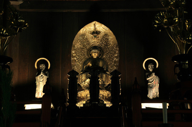 Statue of Buddha at an altar