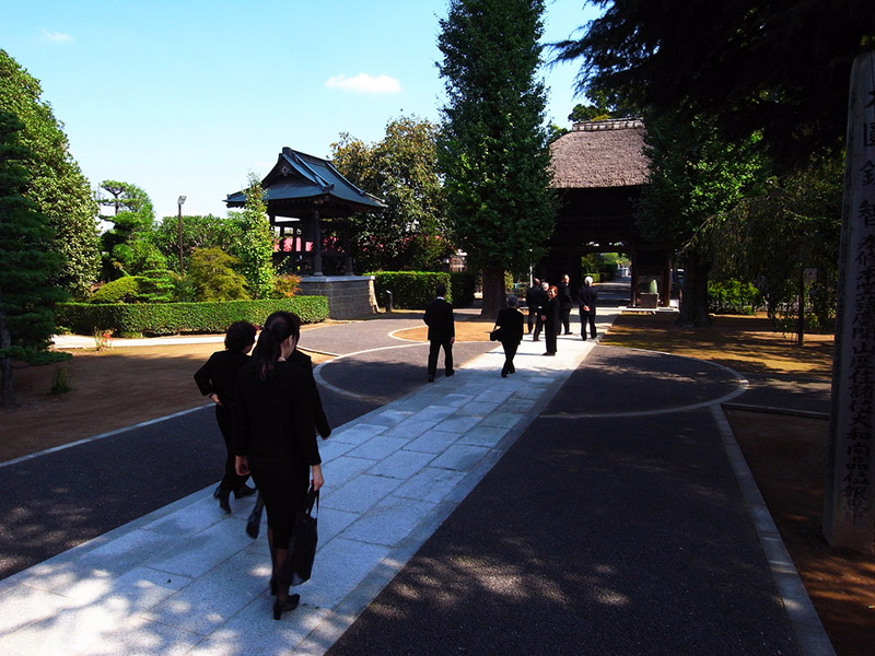 Mourners head to a Buddhist memorial service