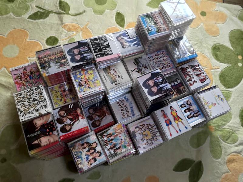 stacks of japanese music cds on carpet