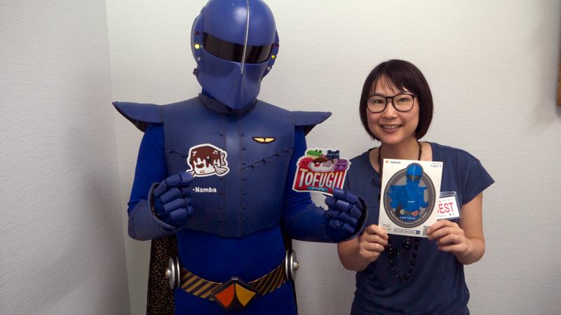 Rapi:tldier the Japanese train superhero poses with Mami from Tofugu