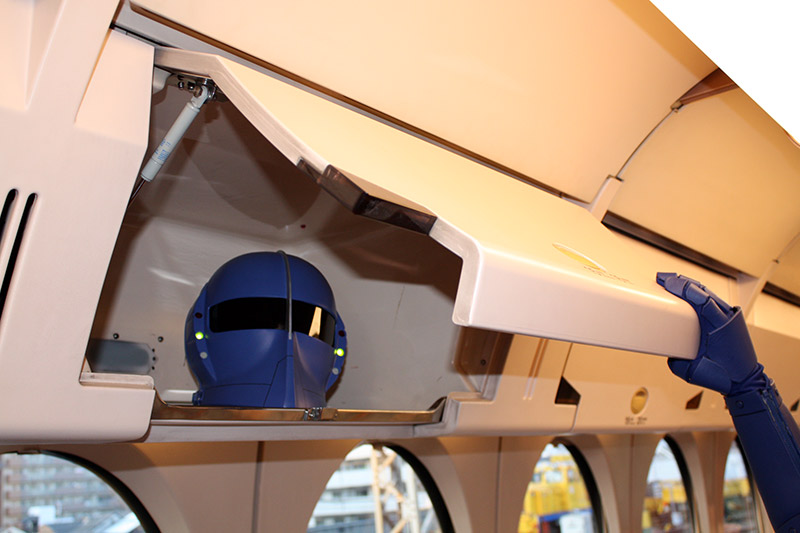 The Rapi:tldier helmet stored in an overhead bin on Rapi:t the train