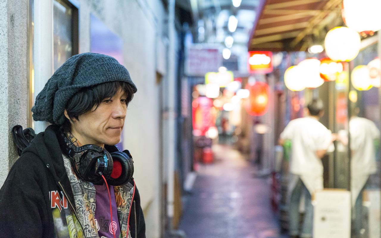 middle-aged japanese man standing outside