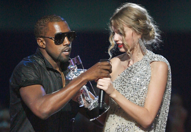 Kanye West pulling the mic away from Taylor Swift