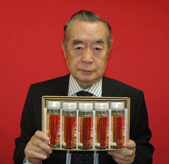 Dr. NakaMats holding a series of bottles