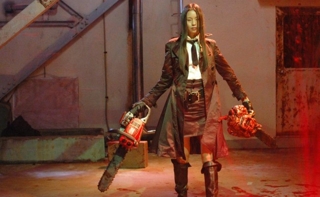 woamn holding two chainsaws in weird japanese movies