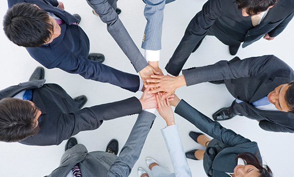 Employees of a Japanese company joining hands