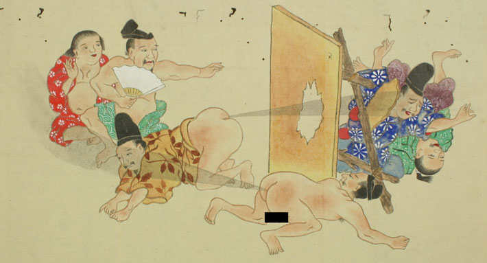 A Japanese man's fart blows through a wooden panel