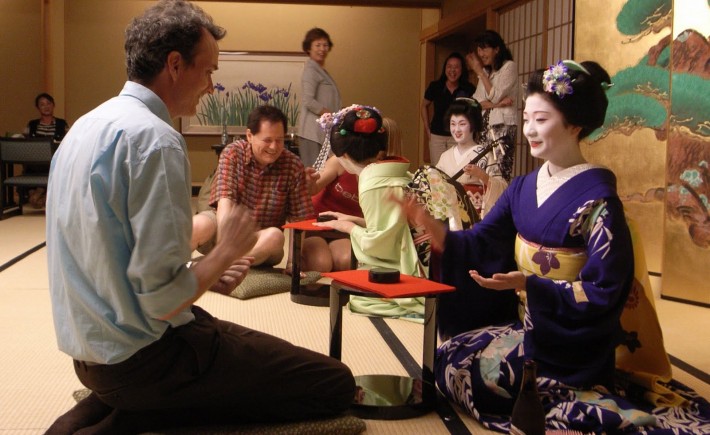 Maiko plays drinking games with a guest in Japan