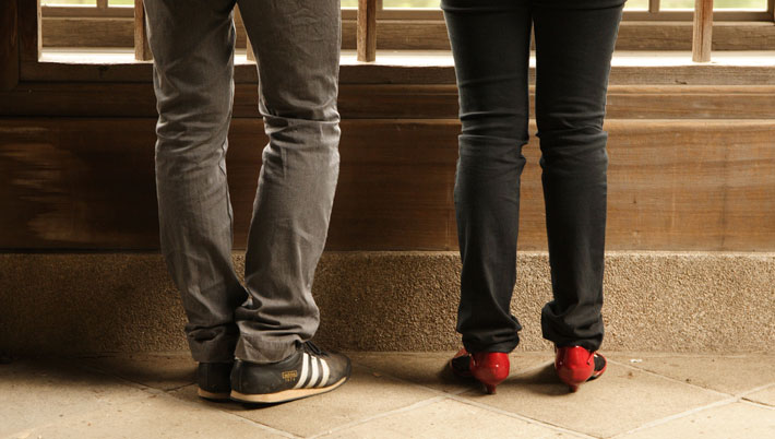 A shot of a young couple's shoes