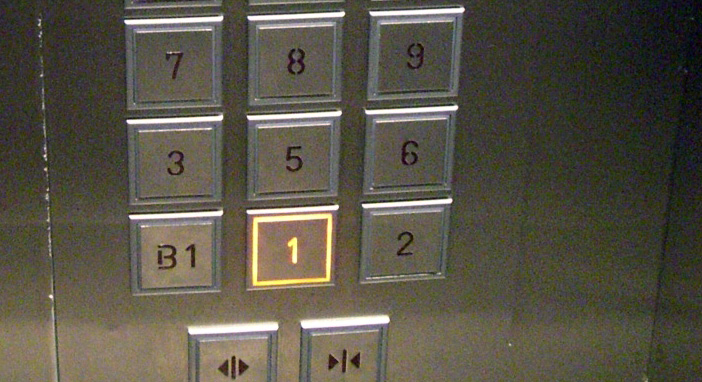 Buttons on an elevator that skipps the number four