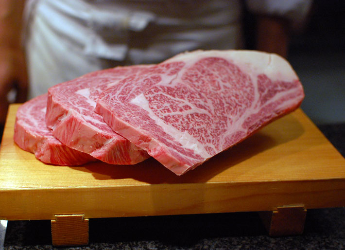 slices of kobe beef on cutting board