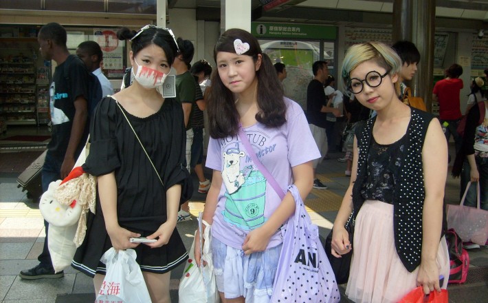 a very fashionable Japanese girl wearing a surgical mask