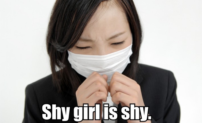 A shy Japanese girl wearing a surgical mask