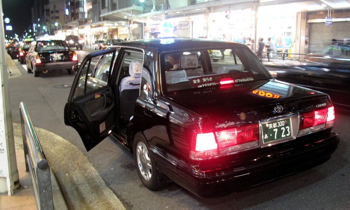 Japanese taxi with its automatic doors open