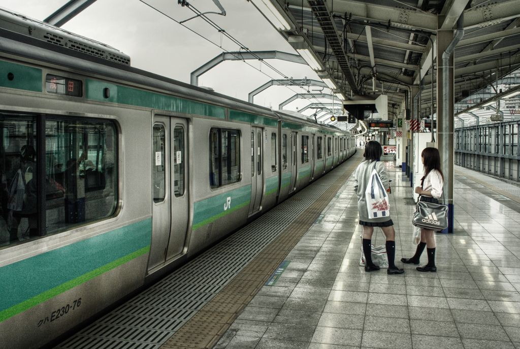 two girls waiting for the train