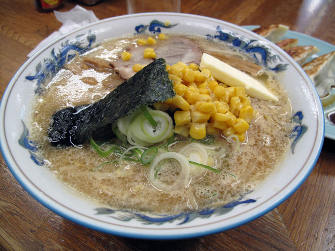 A serving of corn in a bowl of ramen