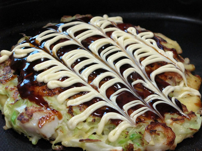 mayonaise spread on top of okonomiyaki