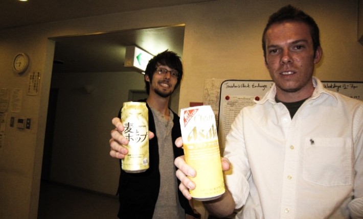 John with a friend holding a can of Japanese beer