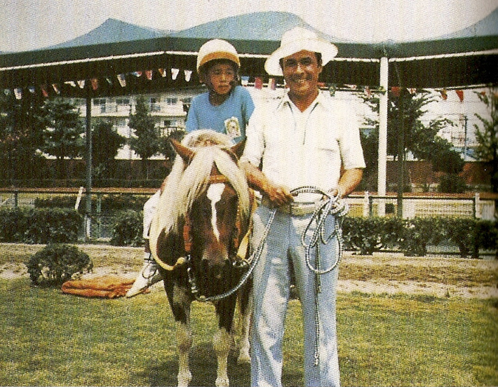 ichrio suzuki as a boy on a pony next to his father