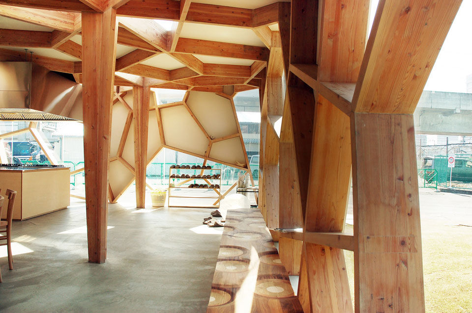 wood pavilion with geometric panels sumika pavilion by toyo ito