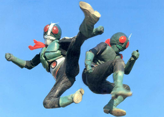 two people in costume doing jump kicks