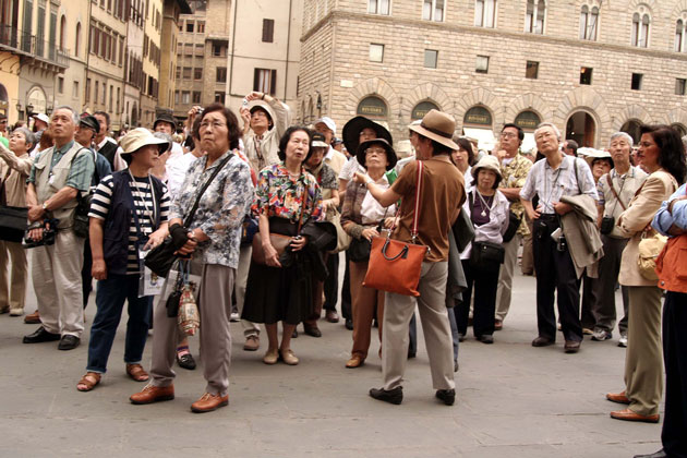 A large group of Japanese tourists in Italy