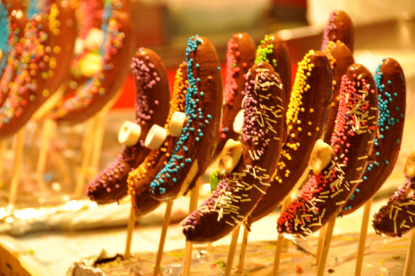 Chocolate coated bananas on sticks