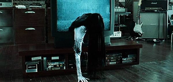 Sadako from The Ring climbing out of a tv