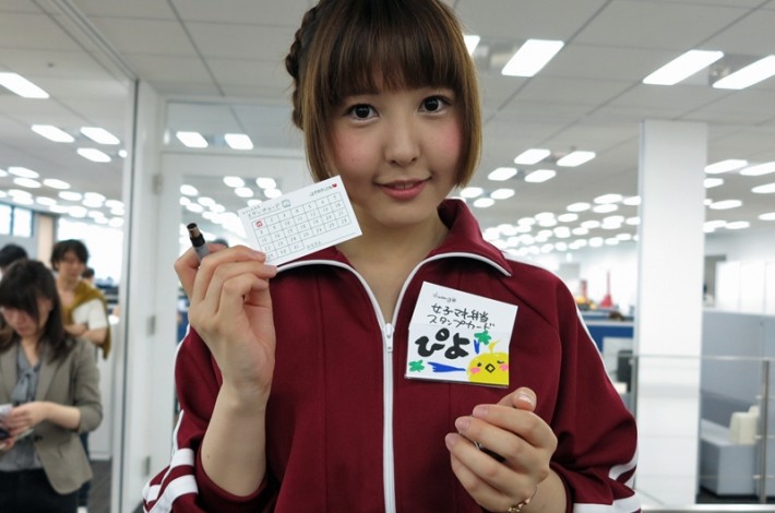 Joshi Mane Bento girl holding up a card