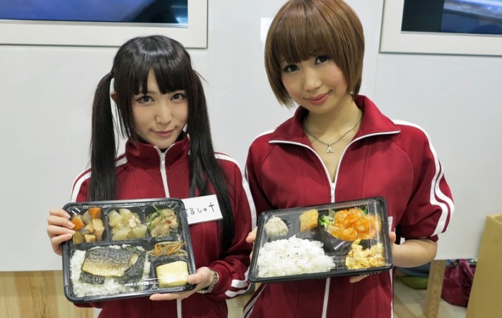 Two Joshi-Mane in red tracksuits with bento