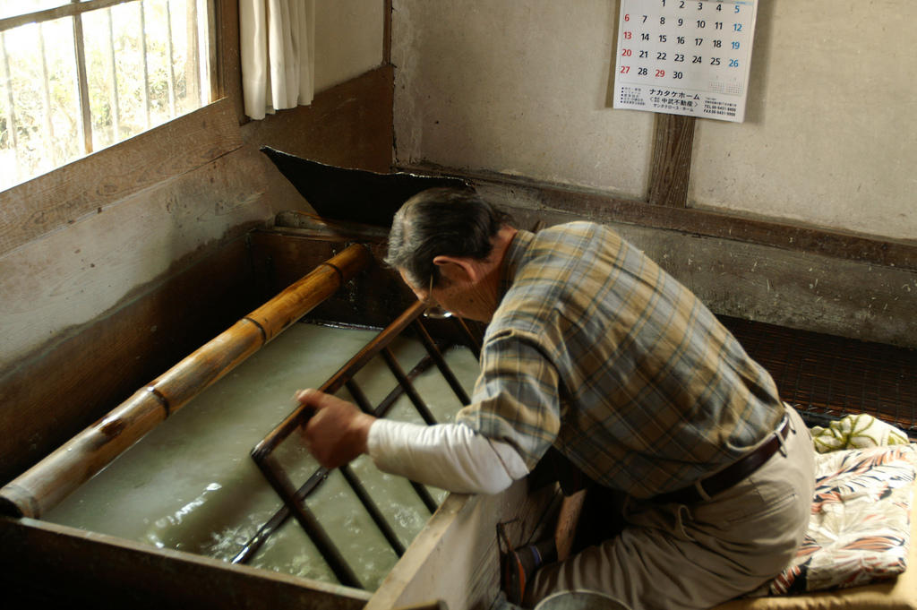 man making washi tape paper