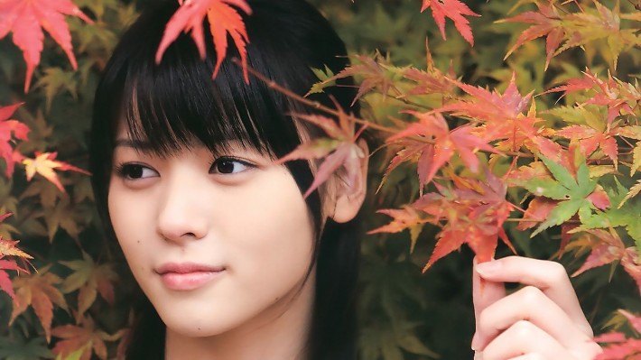 japanese woman surrounded by leaves