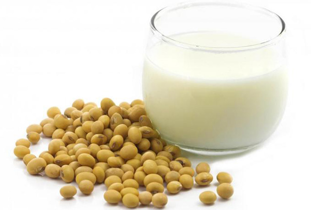 soy milk glass with soy beans