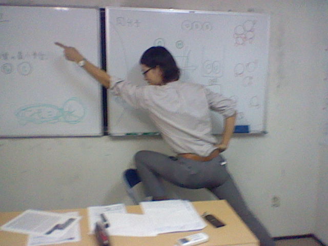 sexy juku teacher pointing man with white board