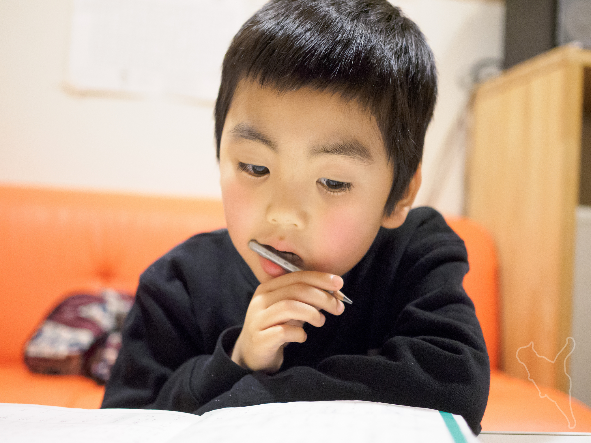 a little japanese boy studying