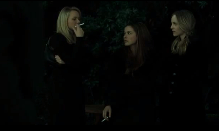 three girls dressed in black smoking definitely witches