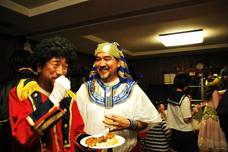 costume dinner with asian men wearing egyptian costumes