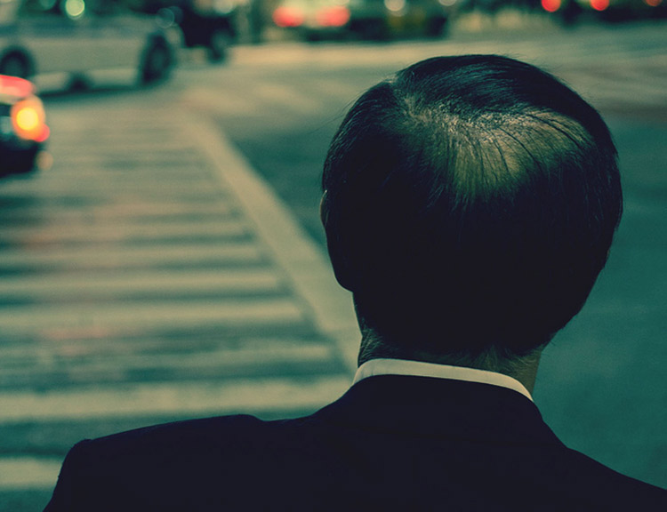 man in suit back of head