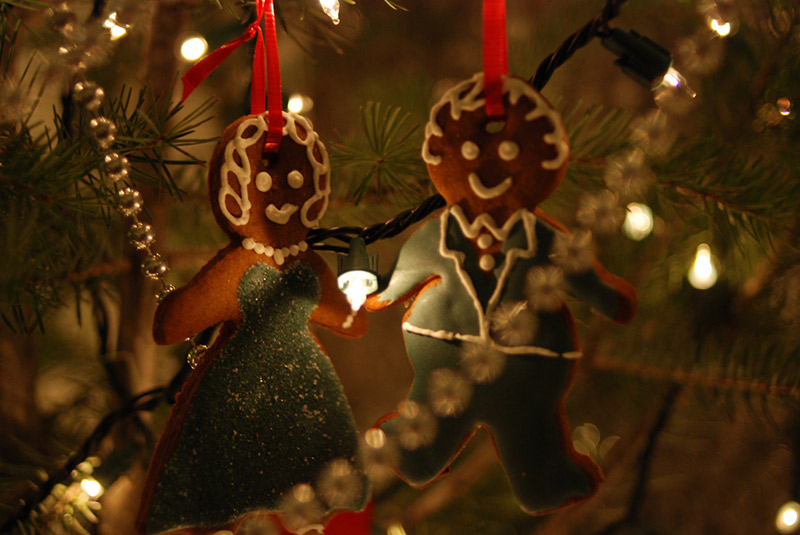 gingerbread cookies hanging from christmas tree